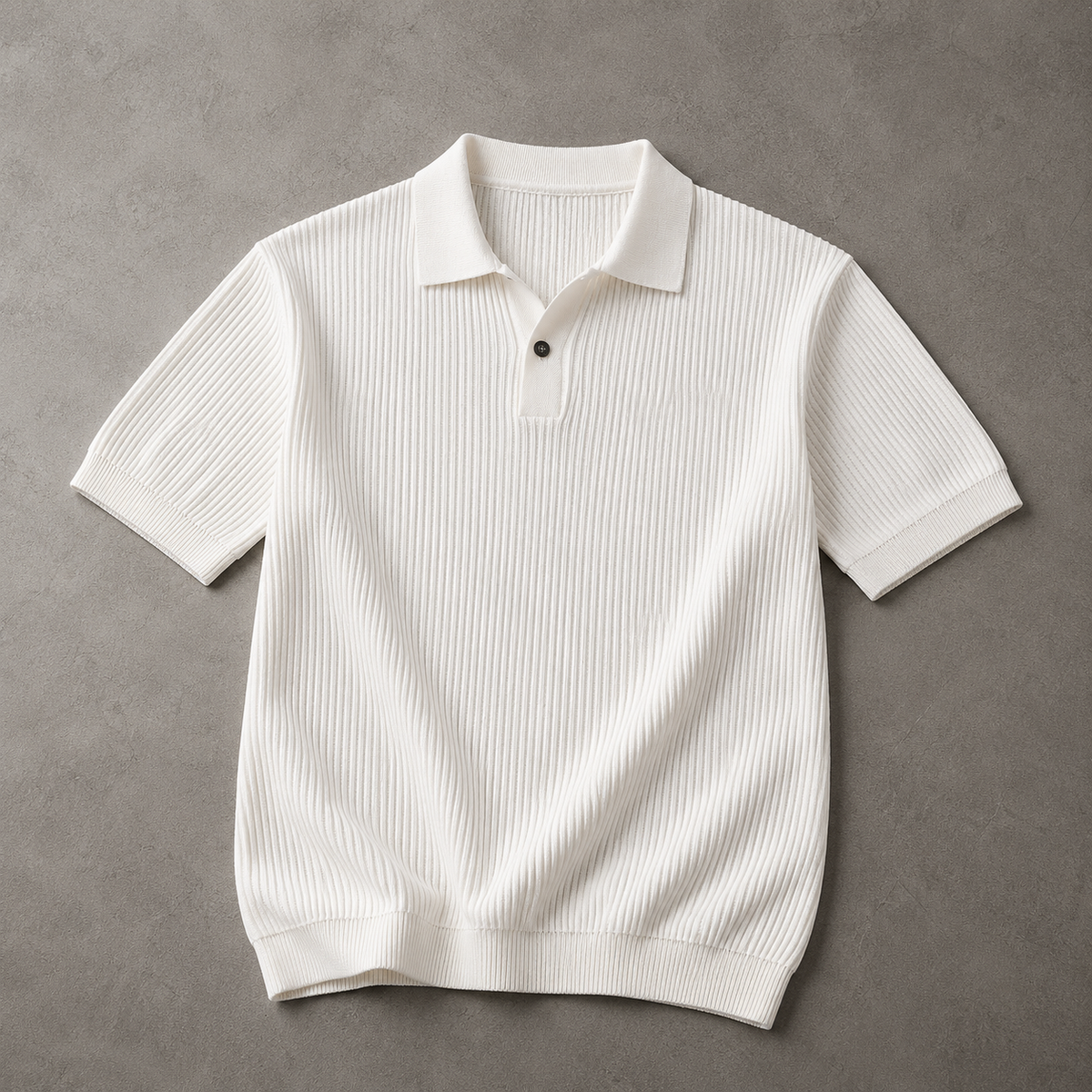 Cream Ice-Silk Knit Polo Shirt laid flat on a textured neutral floor