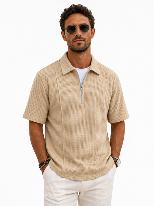 Male model wearing the beige Meridian Half-Zip Knit Polo — professional studio photo