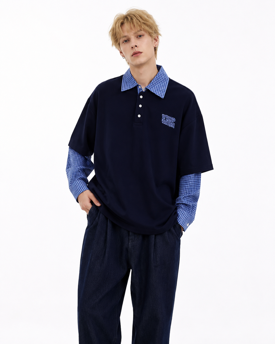Male model wearing navy retro patchwork long-sleeve polo, front view on white background