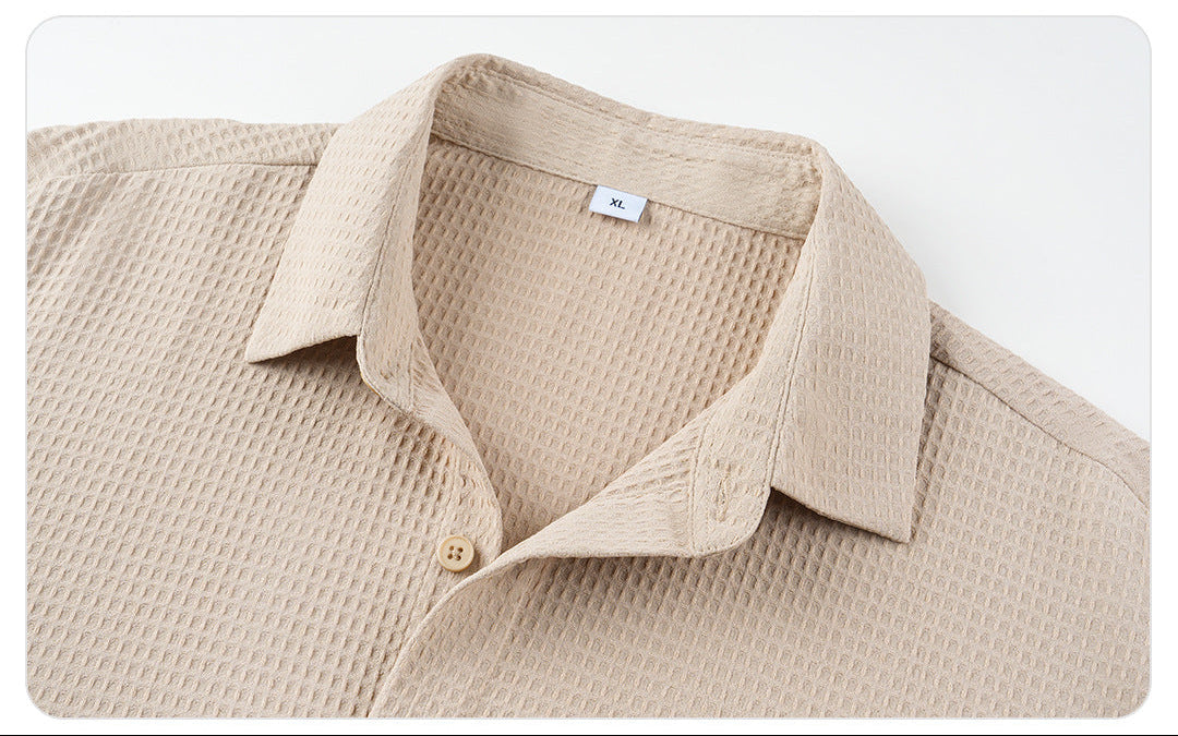 Beige textured shirt with collar on a white background