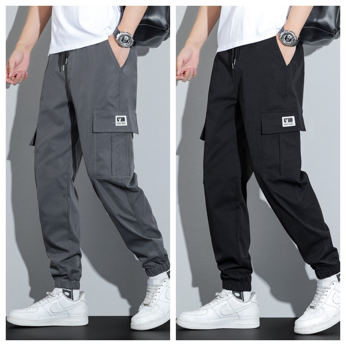 Two pairs of cargo pants, one gray and one black, worn by a person on a plain background.