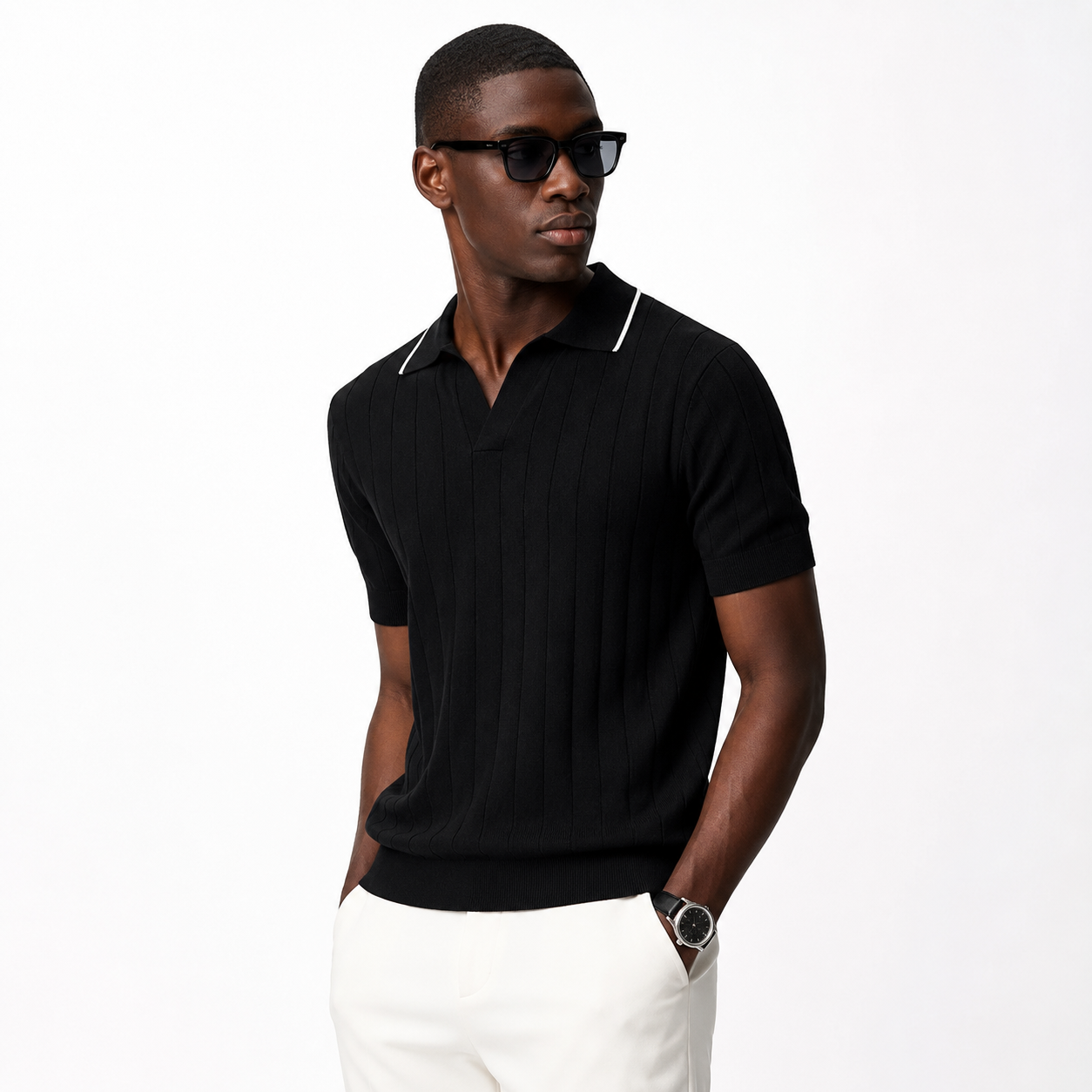 Black ribbed knit polo styled on male model against white studio background