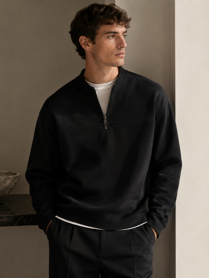 Professional male model wearing the Black Clifton Layered Zip Sweatshirt — front view