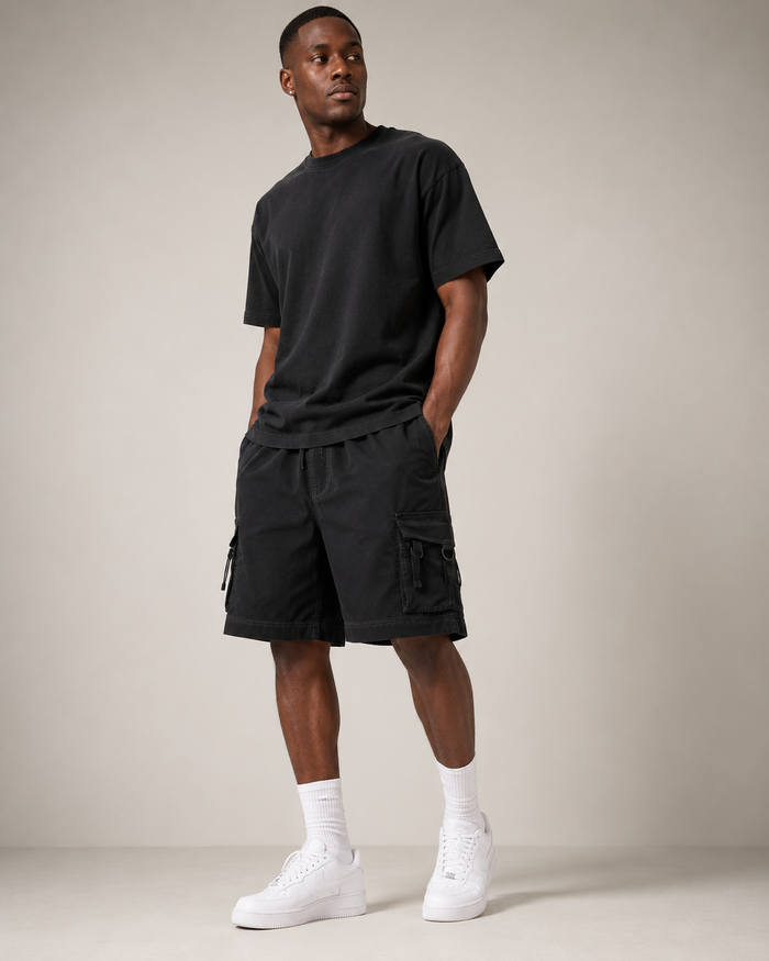 Black Court Athletic Shorts styled on a male model, front view