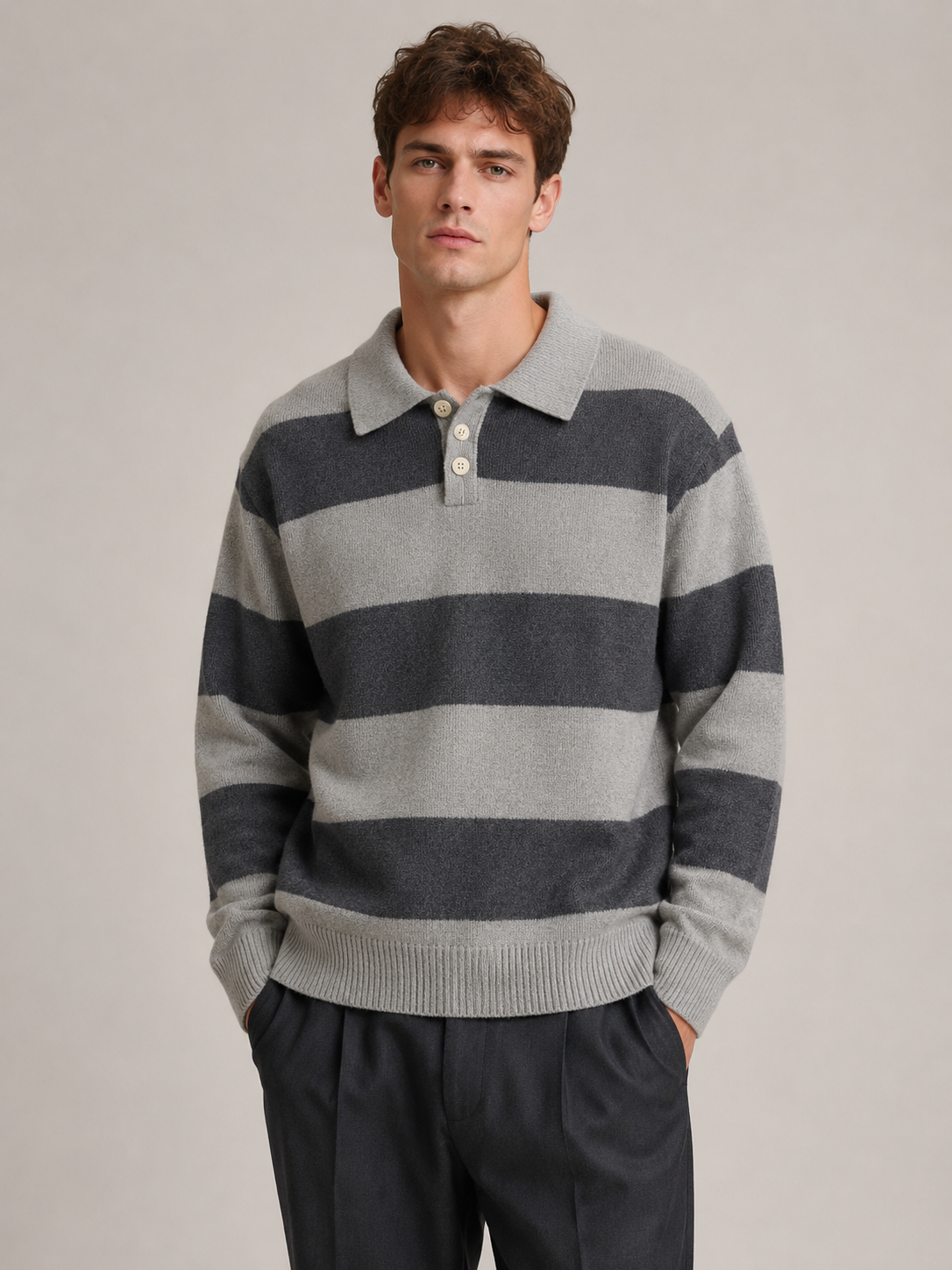 Male model wearing a gray contrast-collar striped knit polo sweater, front view in a professional studio