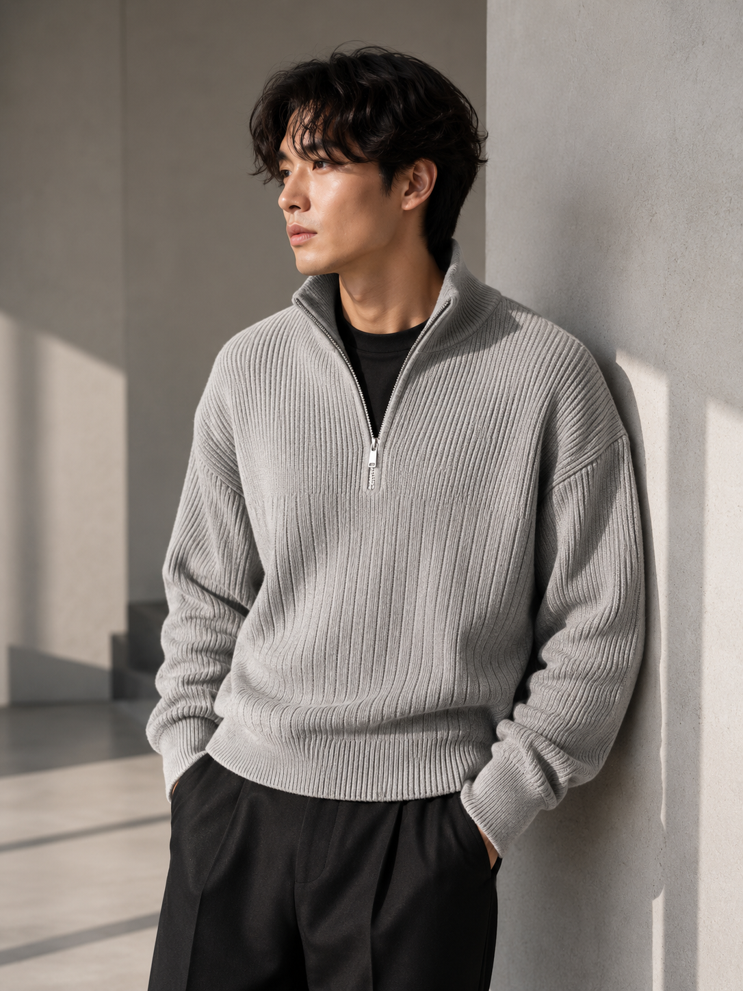 Male model wearing gray half-zip ribbed sweater front view