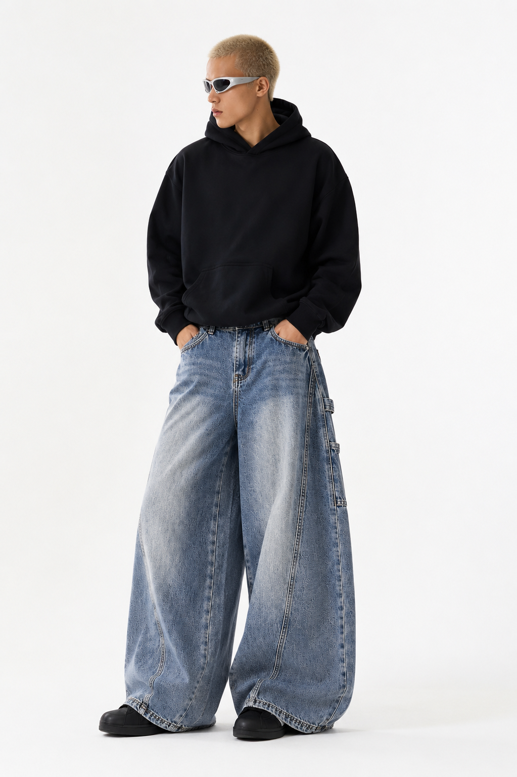 Male model wearing Hudson Wide-Leg Jeans in vintage blue wash