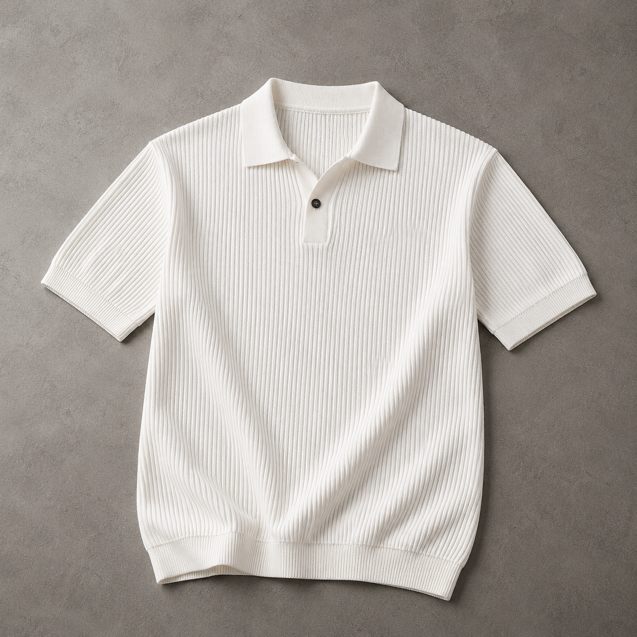 Cream Ice-Silk Knit Polo Shirt laid flat on a textured neutral floor