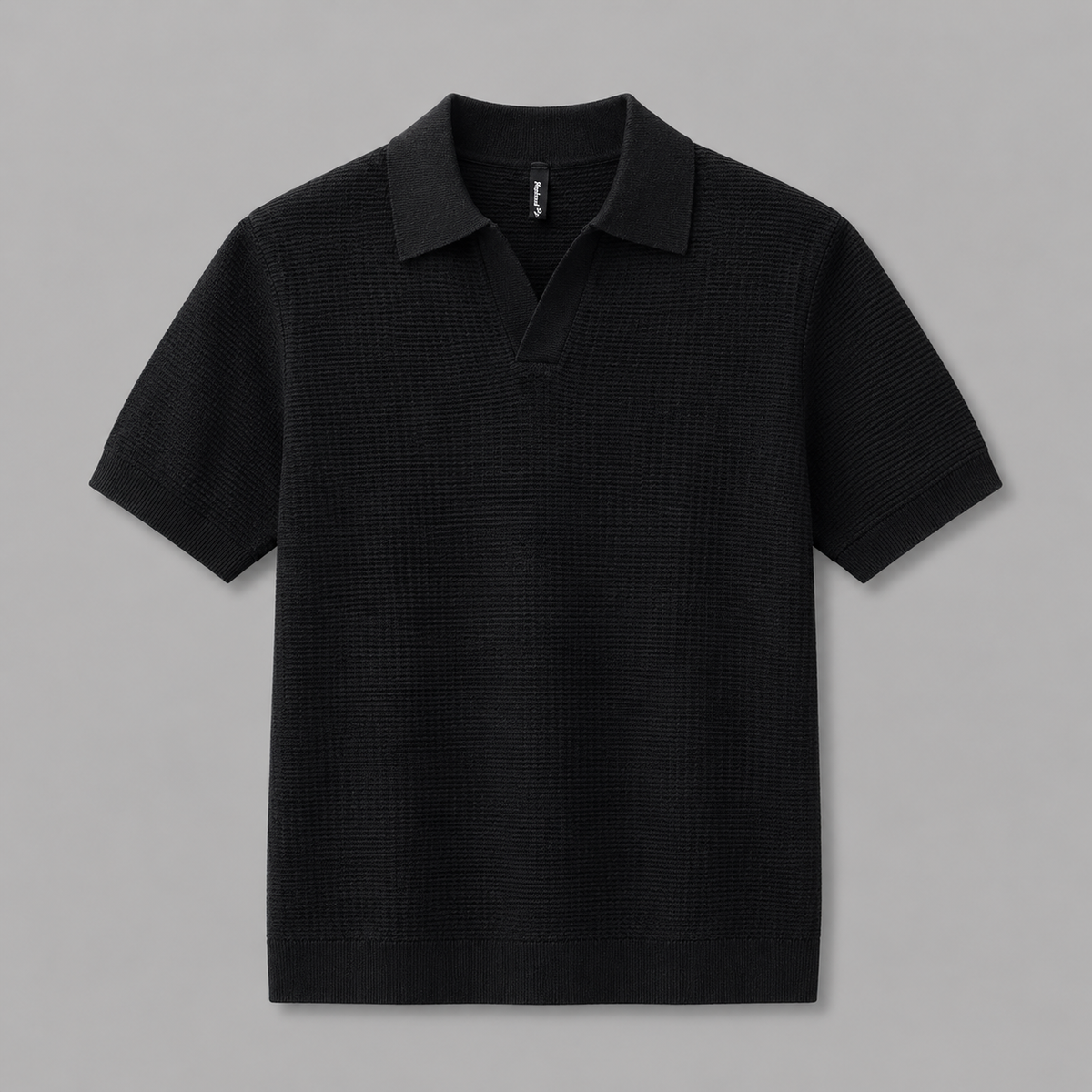 Black Ivy Knitted Polo, front view on neutral gray background