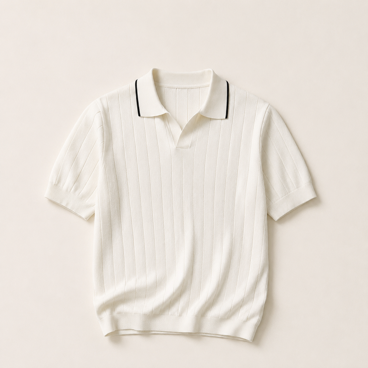 White ribbed knit polo shirt with black collar piping, flat lay