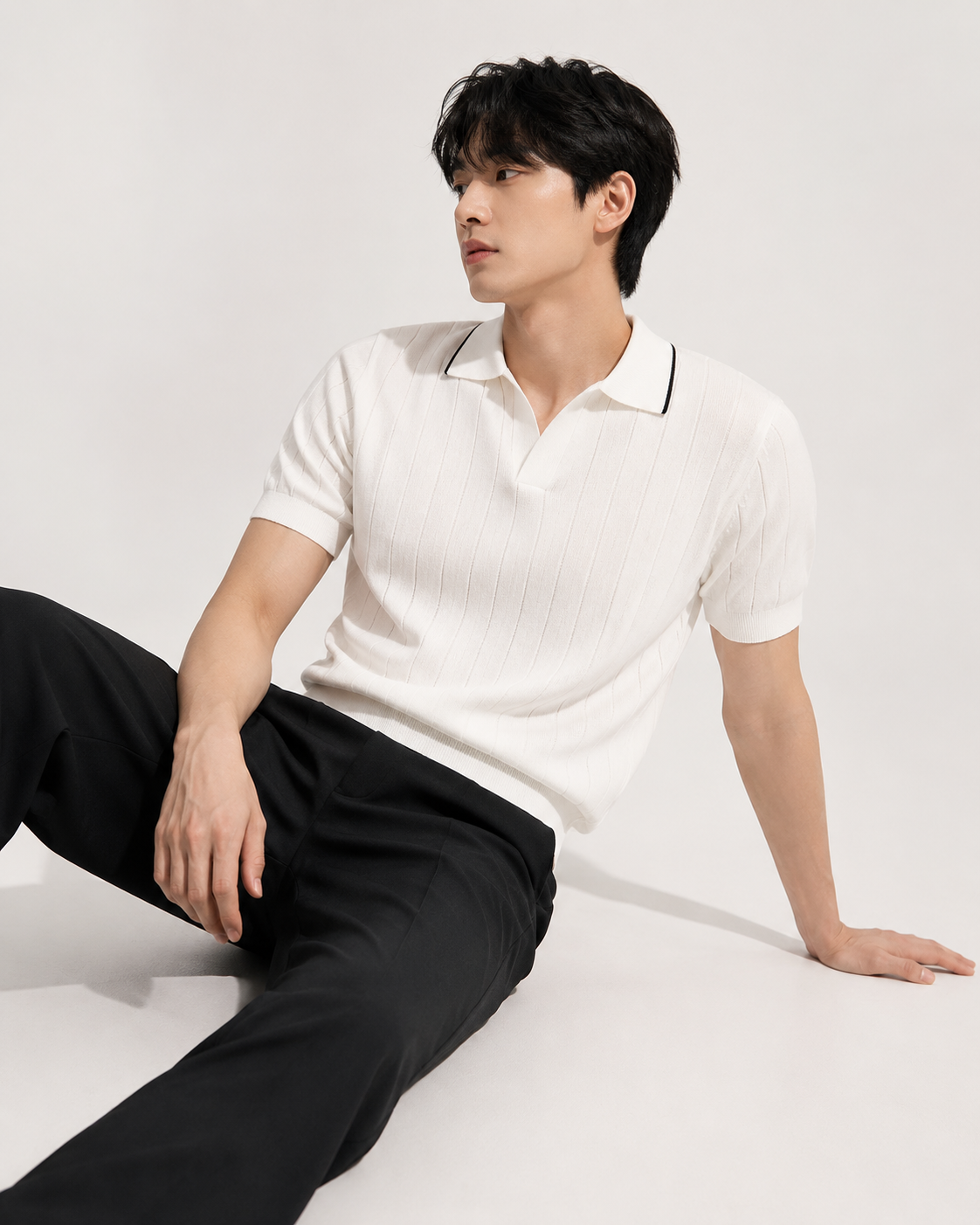 White ribbed knit polo shirt styled on male model