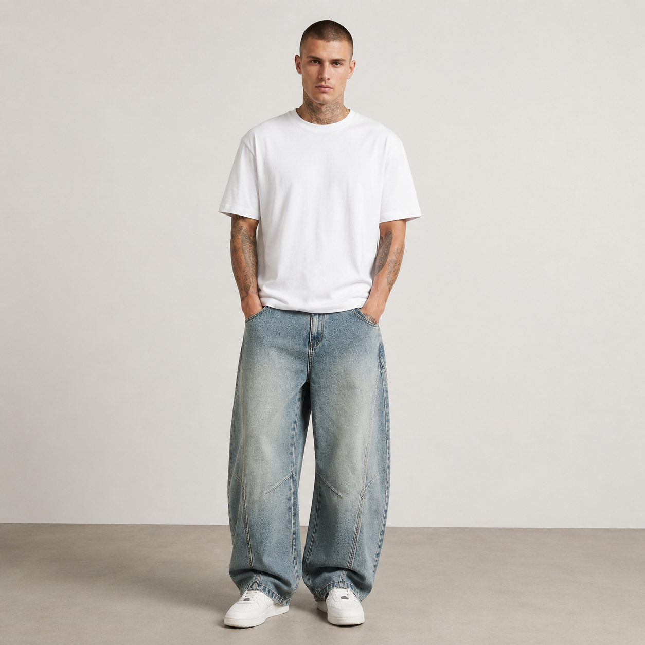 Nikolai Volkov wearing light-wash loose straight-leg utility jeans, front view in a professional studio