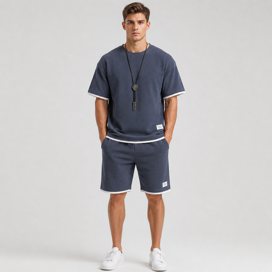 Nikolai Volkov wearing a navy waffle-knit T-shirt and shorts set, front view in a professional studio