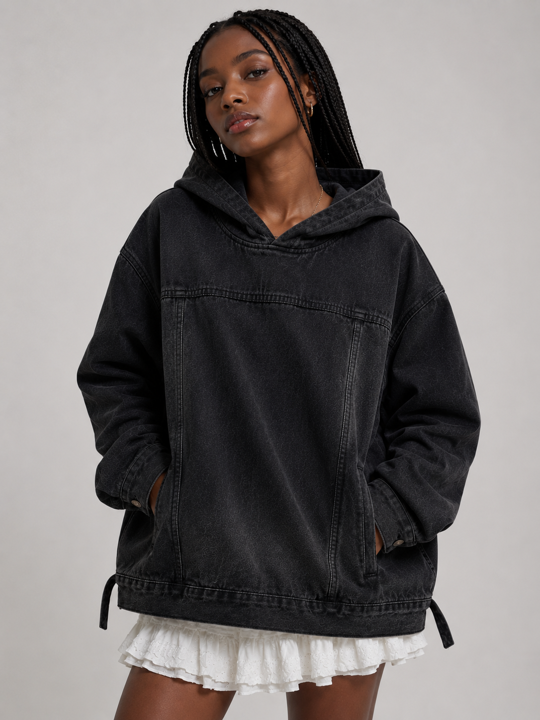 Female model wearing the Nomad Hooded Denim Jacket in black wash, alternate look