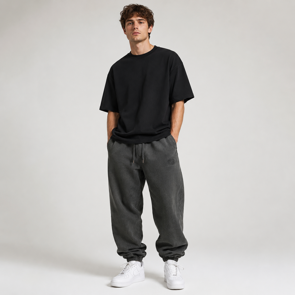 Oversized Harajuku Cargo Joggers in charcoal on model front view