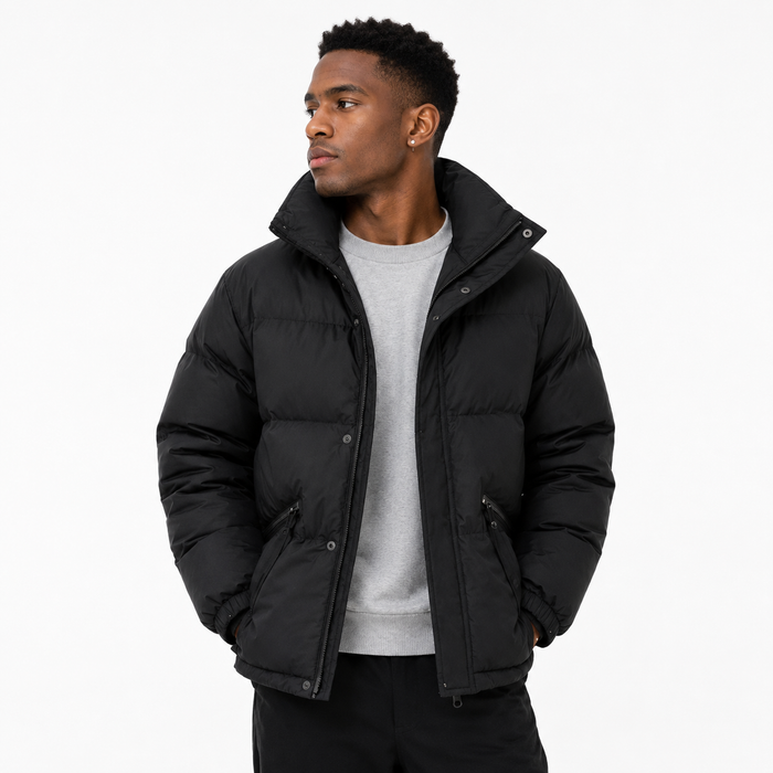 Black male model wearing black Quilted Padded Jacket on white background