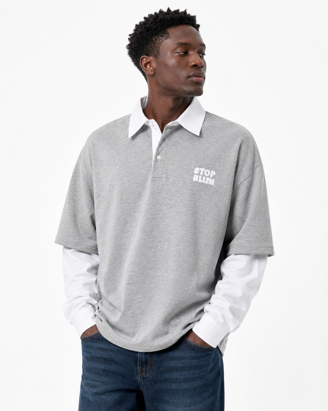 Black male model wearing grey retro patchwork long-sleeve polo, front view on white background