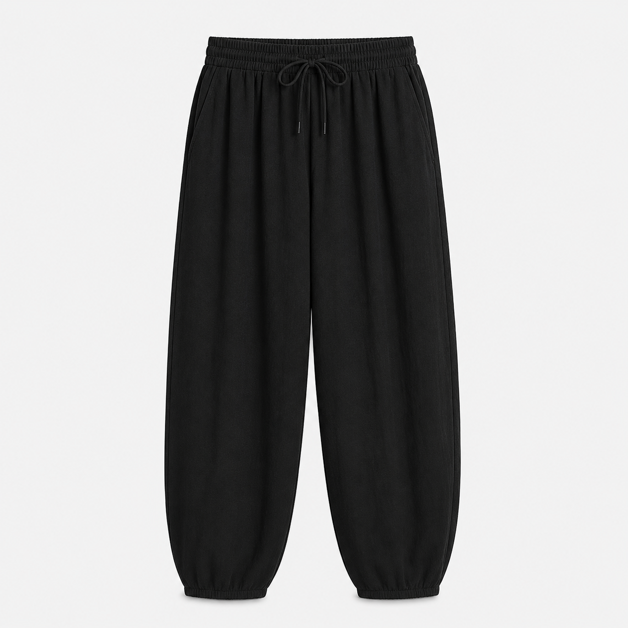 Black relaxed tapered drawstring pants, front product view on white background