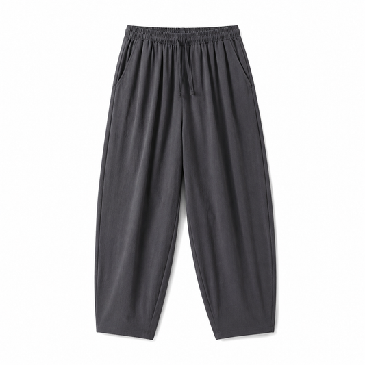 Dark gray relaxed tapered drawstring pants, front product view on white background