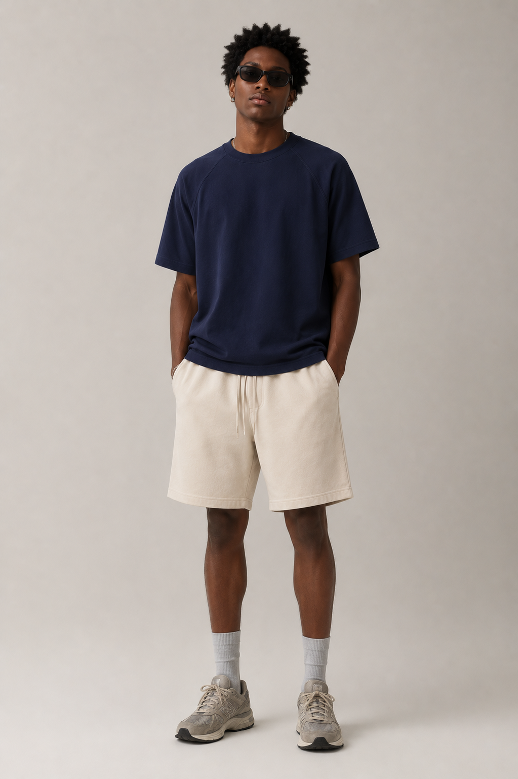 Professional male model wearing the Stitchwork Cotton Tee in sapphire blue — front view