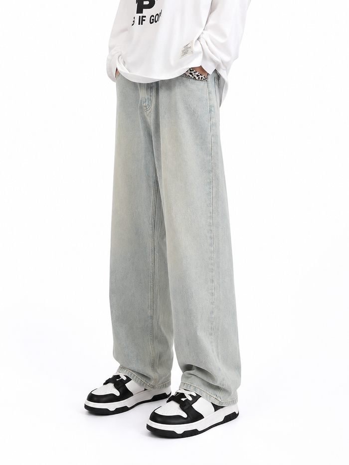 Model wearing light wash Washed Blue Straight-Leg Jeans, front view