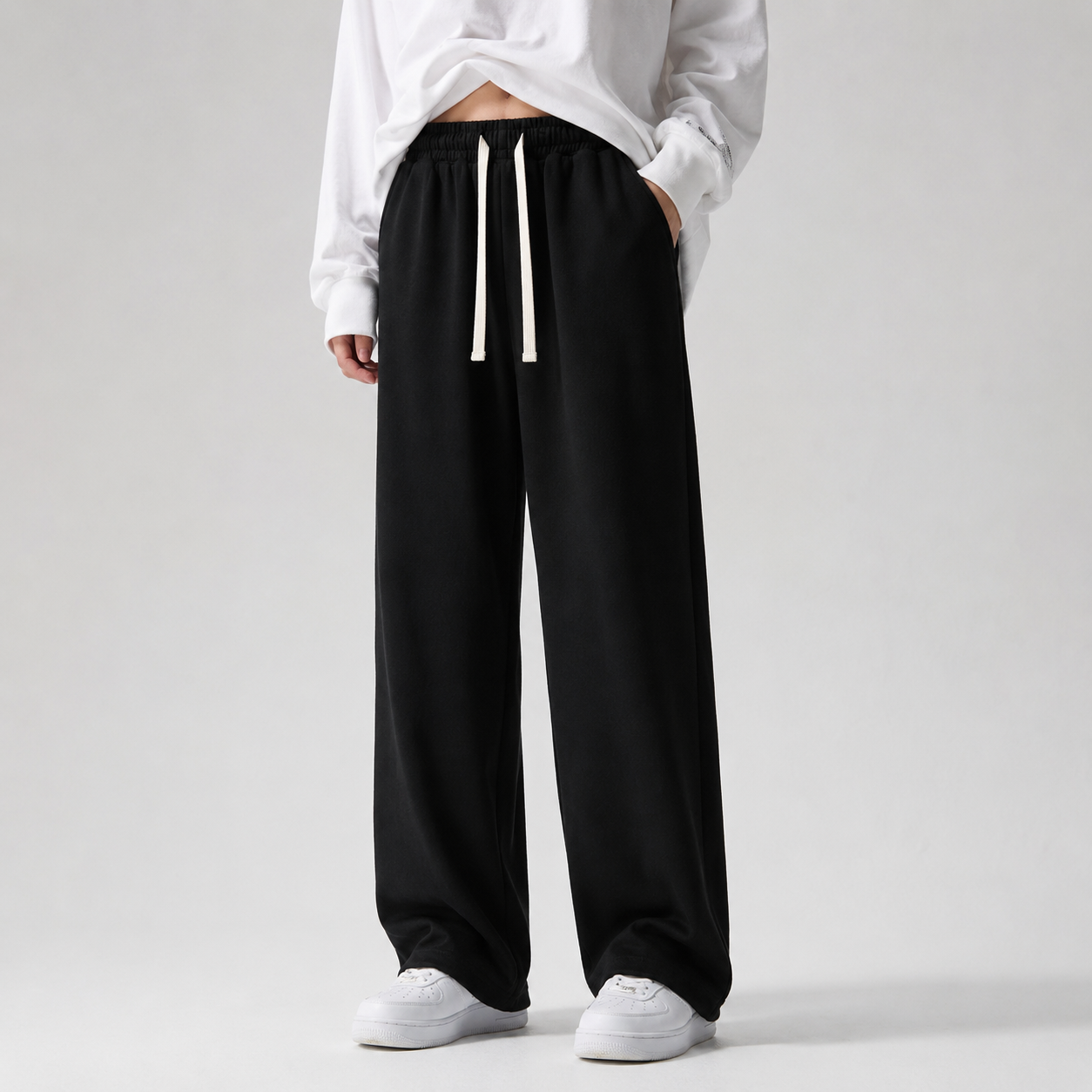 Model wearing black wide-leg sweatpants